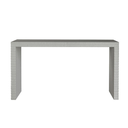 The Lance Console Table is a rectangular, modern piece with a minimalist design and textured geometric edges, finished in sleek white gesso and displayed against a white background.