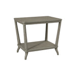 The Rye Rectangular Side Table in Modern French Grey features an open lower shelf and gently tapered legs, all in a weathered stone finish for a contemporary look.