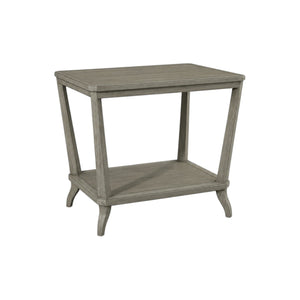 The Rye Rectangular Side Table in Modern French Grey features an open lower shelf and gently tapered legs, all in a weathered stone finish for a contemporary look.