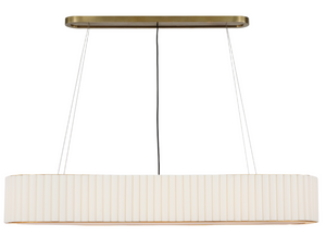 An elongated, cream-colored Palati Large Linear Chandelier, Antique Brass hangs suspended by thin wires from a rectangular brass ceiling mount, exuding an elegance that harmonizes with its modern edge.