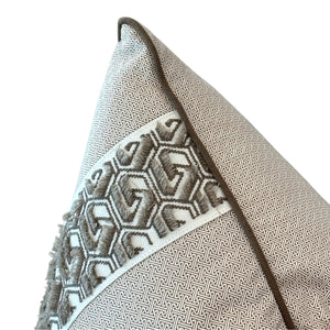 Close-up of the Lattice Cocoa Pillow with Tape Trim, showcasing a geometric woven pattern and textured band in neutral beige and grey tones, crafted from premium materials.