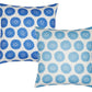 The John Robshaw Aleesa Outdoor Pillow offers a circular floral pattern in blue and light blue on a white background. Designed to be sun-resistant, this square pillow adds elegance to any patio while enduring the elements.