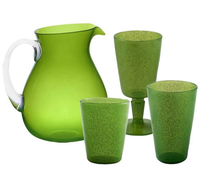 The Memento Acrylic Lime Collection features a green pitcher with a clear handle that pairs beautifully with three vibrant drinking glasses, including one stemmed option, making it ideal for adding elegance to outdoor dining occasions.