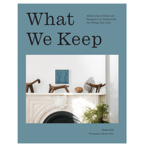 AB What We Keep by Jean Lin features a minimalist fireplace with stylish decor and framed art on its cover—ideal inspiration for collectors and fans of interior design books.