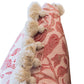Close-up of the Peacock Garden Lumbar Pillow, showcasing its pink and white floral pattern and cream-colored pom-pom trim along the edge, with a hidden zipper for a seamless look.