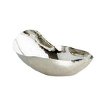 The Freeform Bowl is a reflective, asymmetrical serving bowl made of nickel-plated brass with a textured surface, shown on a white background.