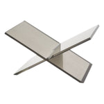 Two clear lucite panels with silver accents intersect diagonally on a white background, creating an X-shaped, minimalist silhouette inspired by the Lucite Silver Book Stand’s modern, durable design.