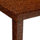 Close-up of the Bradford Coffee Table corner, featuring a brown and orange mottled faux tortoise shell pattern on both tabletop and leg, bringing unique style to your home decor.
