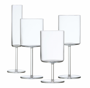 Four clear, empty wine glasses of varying shapes and sizes, showcasing the exquisite Fortessa Modo Collection made from durable TRITAN® Crystal Glass, are elegantly arranged on a white background. The design subtly hints at a Mid-Century Modern aesthetic.