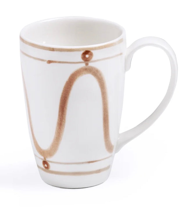 A white ceramic mug with a brown abstract wavy line design and a single brown dot pattern near the rim and base, echoing the hand-painted Themis Z Serenity Beige Collection seen in our handcrafted dinnerware collection.