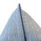 Close-up of the corner of the Roxam Blue Pillow, showcasing its blue and white textured fabric and piped seam, photographed against a white background. This custom pillow features a hidden zipper closure for a seamless look.