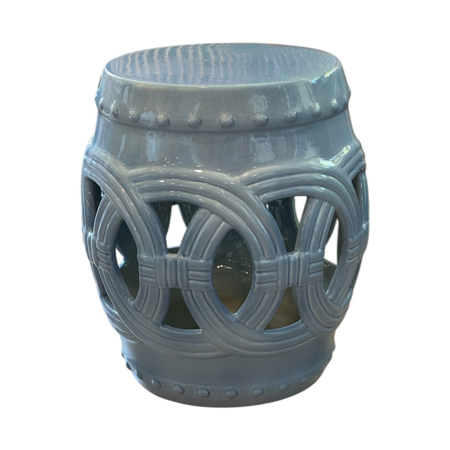 The Mediterranean Blue Circle Stool is a glossy light blue ceramic garden stool with open circular and lattice side designs, offering an antique look inspired by traditional dragon kiln artistry.