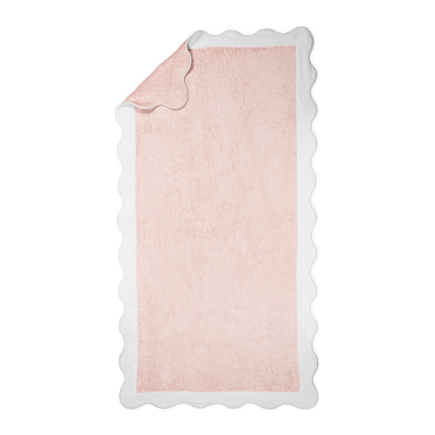 The Neptune Pool Towel in rectangular pink Cairo cotton with a scallop edge is displayed flat, with one corner partially folded over.
