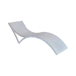 The Bari Stacking Chaise Lounge in Chambray features a modern curved design with light-colored resin wicker, ideal for outdoor relaxation and shown against a white background.