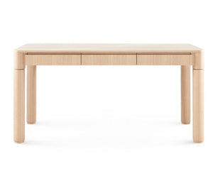 The Nolan Desk is a rectangular table with rounded corners and legs, showcasing a minimalist retro design and a smooth surface crafted from European white oak veneer.