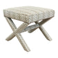The X Bench features crisscross legs and a brown and white chevron-patterned upholstery, offering a sophisticated look.