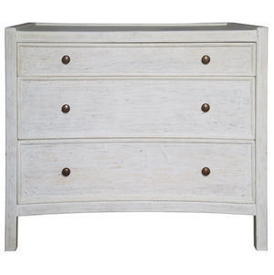 The Hampton Large Side Table is a whitewashed wooden piece with three drawers, each adorned with two round metal knobs, and features a charming classic finish.