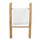 A white fringed towel hangs on the Provo Leaning Towel Rack's middle rung, highlighting its stylish light teak design and durability against a plain white background.