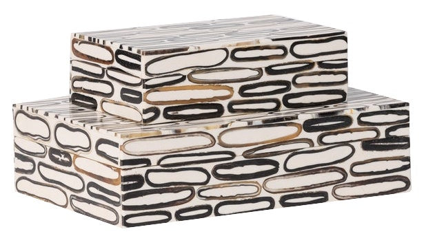 Two rectangular boxes with a geometric pattern of elongated black, white, and beige shapes stacked on top of one another create a Corwin Horn Box, Small.