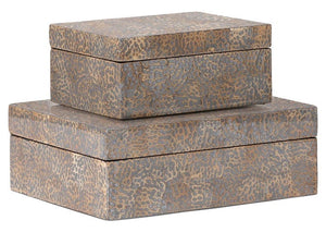 Two rectangular, stackable Della Box Silver Eggshell, Small with a textured pattern in an elegant eggshell hue. The boxes vary in size, with the smaller one placed on top of the larger one.