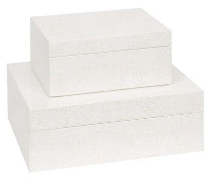 Two white Della Box, Small of different sizes, stacked one on top of the other, resemble an intricate layer often seen in traditional handicrafts.