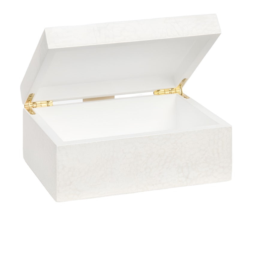 A white rectangular box with gold hinges and a textured surface is shown open, displaying its empty interior. The delicate craftsmanship reflects the traditional handicraft techniques used to create such intricate layers. This is the Della Box, Small.