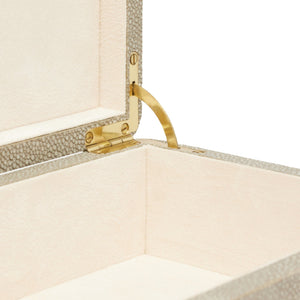 An open beige textured Kiraz Sand Shagreen Box, Large with a soft suede interior lining, a brass tab, and a gold hinge.