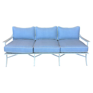 The Haret Outdoor Sofa, a three-seater from our metal outdoor collection, features a white frame with light blue cushions and white piping, shown against a plain white background.