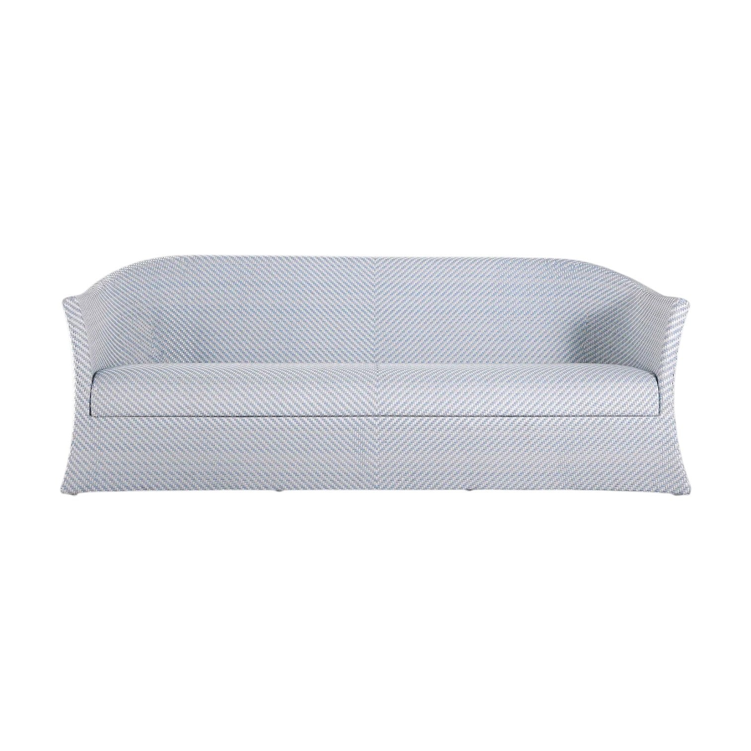 The Bari Sofa in Chambray is a light blue and white striped outdoor sofa with water-resistant cushions, curved arms, a skirted base, and is shown from the front.