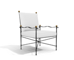 The Amalfi Adjustable Chain Lounge Chair is a white cushioned armchair with a black powder coated steel frame, featuring gold spherical accents on the armrests and back corners, set against a plain white background.