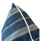 A close-up of the Orlando Stripe Outdoor Pillow, featuring blue fabric with white embroidered horizontal stripes and a white corded edge, crafted from premium materials and shown against a plain background.