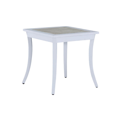 The Bermuda Aluminum End Table is a square white outdoor table with slightly curved wrought aluminum legs and a light-colored tabletop, pictured against a plain white background.