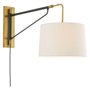 The Anthony Sconce Antique Brass is a wall-mounted swing arm bedside reading light with an antique brass metal frame, white fabric lampshade, and visible black cord.