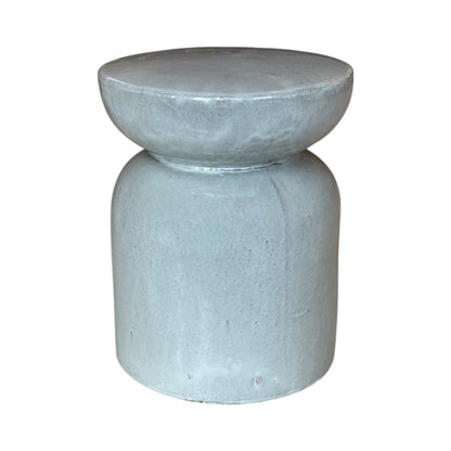 The Gray/White Pedestal Stool features a light gray finish with a rounded top and cylindrical base, crafted from high-quality porcelain and shown against a white background.