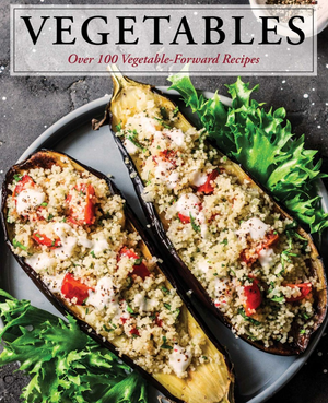 Cover of a cookbook titled "Vegetables" featuring stuffed eggplant halves on a plate garnished with greens, showcasing an array of seasonal recipes.