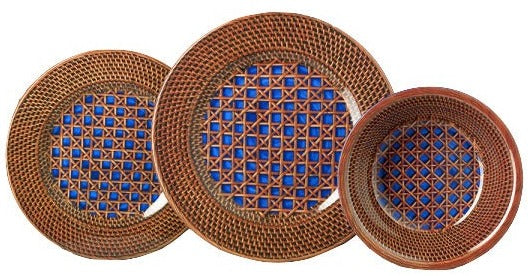 Three plates from the Mario Luca Giusti Patagonia Blue Collection are displayed, showcasing intricate lattice patterns that beautifully blend modern aesthetics with antique charm, each featuring blue geometric designs at their centers.