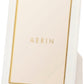 A white picture frame with gold detailing from the AERIN Classic Piero Leather Frame Collection elegantly displaying the word "Aerin" in the center.