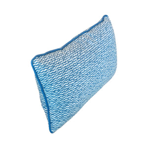 The Popple Blue Outdoor Lumbar Pillow features a blue and white wavy pattern with blue piping, crafted from premium materials, shown against a white background.