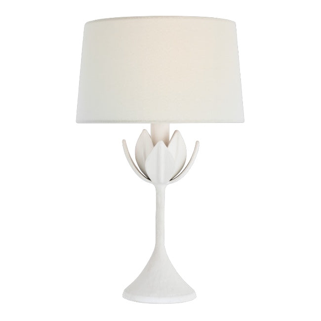 The Alberto Cordless Lamp in Plaster White features a sculpted, flower petal-inspired base and an elegant linen shade.