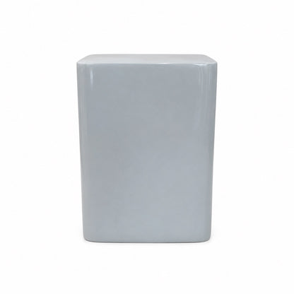 A matte light blue fiberstone square stool with rounded edges, perfect as modern seating or a pedestal accent, is shown against a plain white background.
