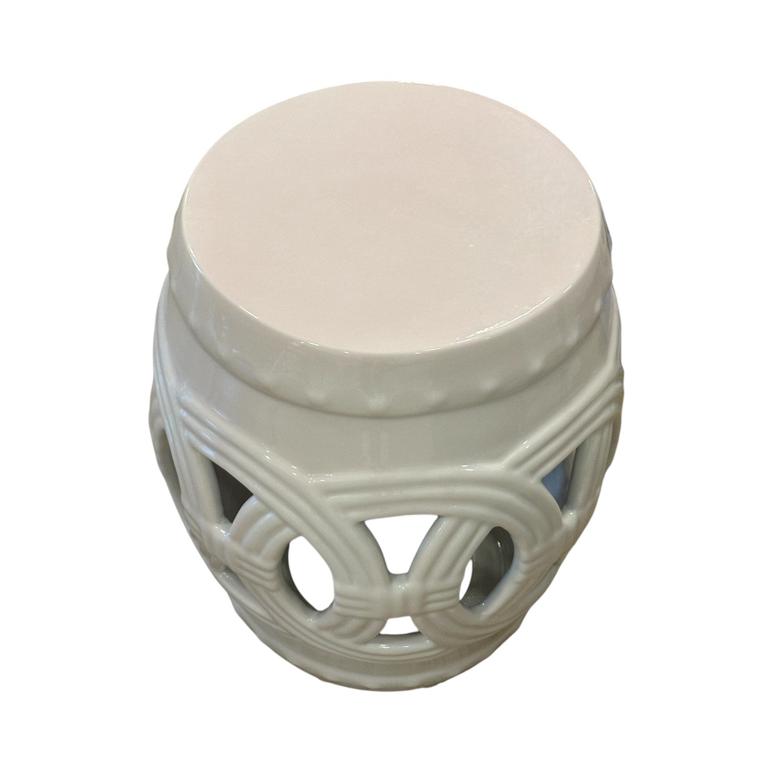 The Fine Porcelain Circle Stool in Flush Pink features a round solid top and decorative openwork lattice sides, crafted from fine porcelain and photographed against a white background.