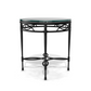 The Amalfi Glass Top Side Table features a round glass top and a black metal frame with circular, scrollwork, and hand-forged lattice designs—ideal for elegant outdoor spaces. Shown against a white background.