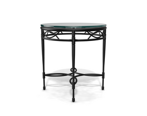 The Amalfi Glass Top Side Table features a round glass top and a black metal frame with circular, scrollwork, and hand-forged lattice designs—ideal for elegant outdoor spaces. Shown against a white background.