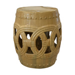 The Circle Garden Stool in Latte features a beige ceramic, cylindrical design with an antique finish, cutout ring pattern, and dotted rim, shown against a white background.