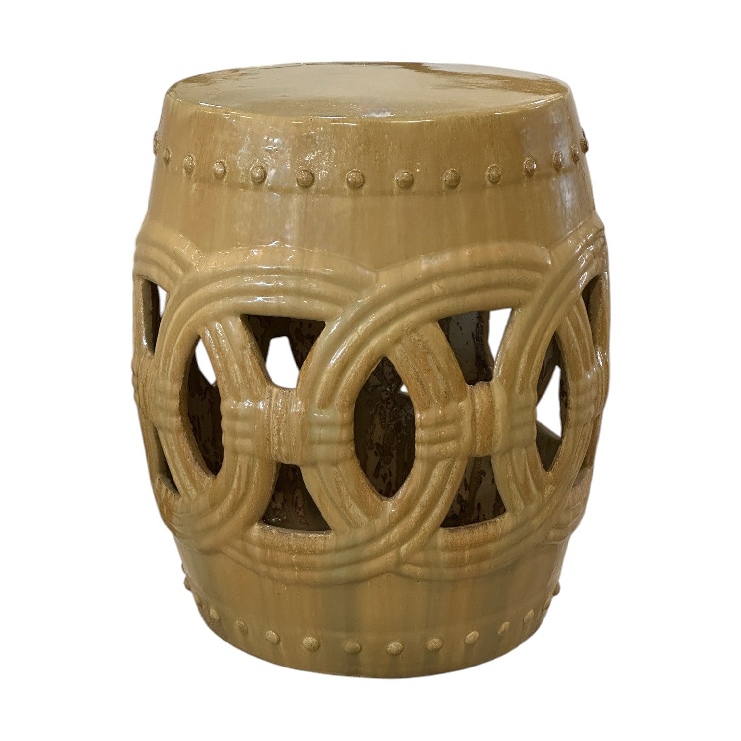 The Circle Garden Stool in Latte features a beige ceramic, cylindrical design with an antique finish, cutout ring pattern, and dotted rim, shown against a white background.