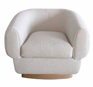 The Obi Lounge Chair is a modern, light beige armchair with rounded edges and a cushioned seat, supported by a wooden base. This piece of home furnishings adds an air of calm and serenity to any room.