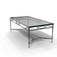 The Amalfi Glass Top Cocktail Table showcases a tempered glass surface and hand-forged steel frame with decorative curved accents, displayed against a plain white background.