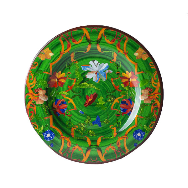 The Mario Luca Giusti Pancale Green Collection offers a decorative plate with a vivid green background, showcasing colorful floral and abstract patterns in red, blue, orange, and white—an exquisite example of Mario Luca Giusti's aesthetic research in modern shapes and colors.