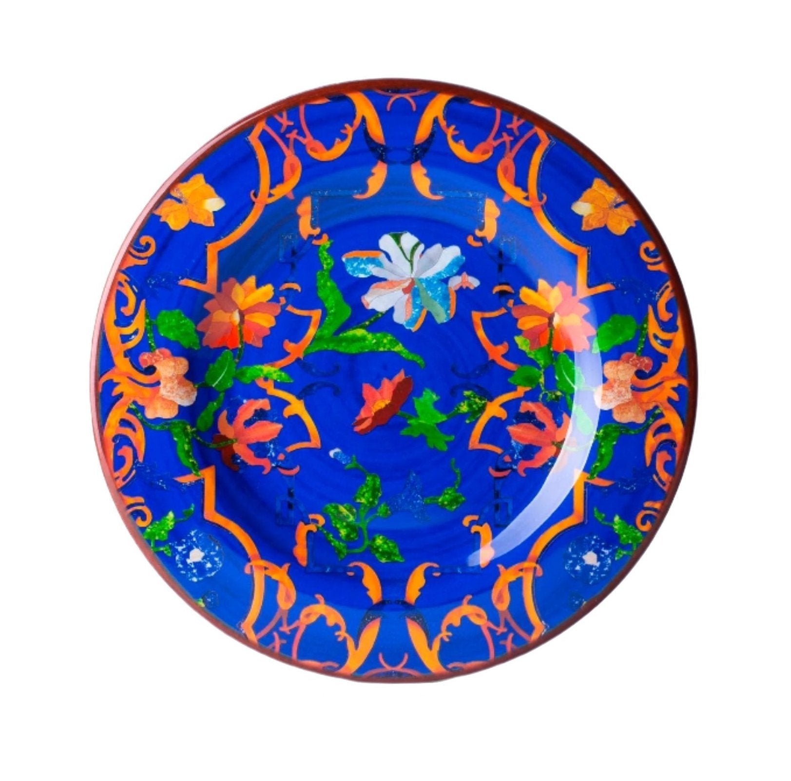 A salad plate from the Mario Luca Giusti Pancale Blue Collection, crafted in blue melamine with an orange and green floral pattern and a prominent white flower in the center, is perfect for adding a touch of elegance to your dinnerware ensemble.