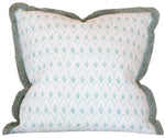 The Arrowhead Rainwashed Pillow is a custom-made square decorative pillow with a light blue and white geometric design, green fringe trim, and crafted from premium materials.